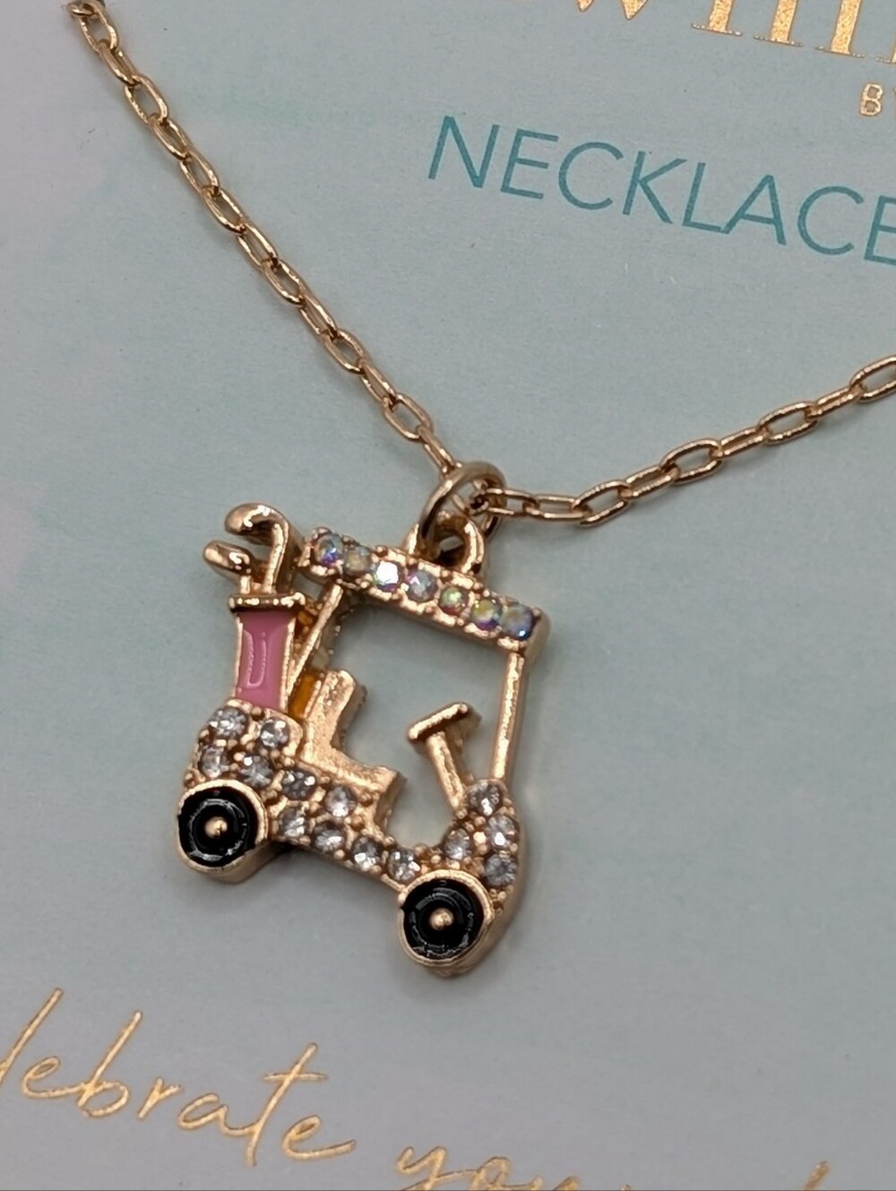 Gold-tone Crystal Golf Cart Necklace with Pink Accent